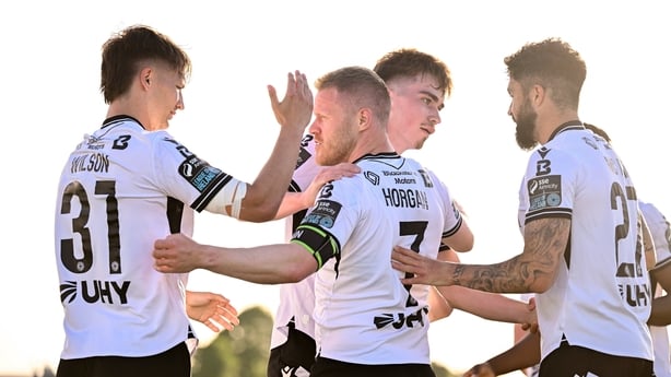 Daryl Horgan of Dundalk, second from left, celebrates with teammates, from left, John Ross Wilson, Eoin Kenny and Declan McDaid after scoring their side's first goal during the SSE Airtricity Men's Premier Division match between Dundalk and Derry City at Oriel Park in Dundalk, Louth.