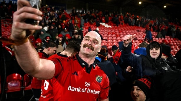 23 January 2026; Oli Jager of Munster takes a selfie with supporters after the United Rugby Championship match between Munster and Dragons at Virgin Media Park in Cork. Photo by Ben McShane/Sportsfile