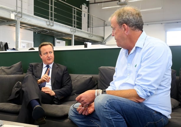 Britain's Prime Minister David Cameron (L) talks with television presenters Jeremy Clarkson (R) during a visit to W Chump & Sons Ltd TV studio in west London on June 16, 2016 ahead of the EU referendum as the prime minister campaigns to avoid a Brexit. Britain goes to the polls on June 23 to vote t