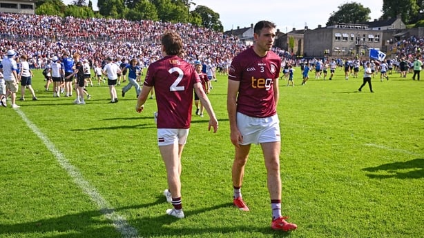 Adam Treanor and Charlie Drumm leave the pitch after Westmeath's defeat to Monaghan in Clones