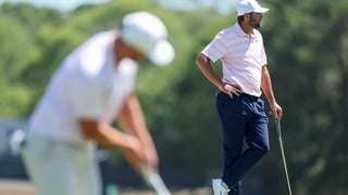 SOUTHAMPTON, NEW YORK - JUNE 21: Scottie Scheffler of the United States looks on from the second green as Wyndham Clark of the United States putts during the final round of the 126th U.S. OPEN at Shinnecock Hills Golf Club on June 21, 2026 in Southampton,
