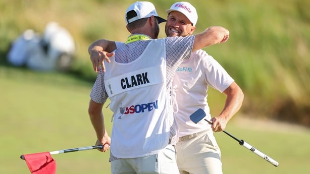 SOUTHAMPTON, NEW YORK - JUNE 21: Wyndham Clark of the United States celebrates with caddie David Pelekoudas after winning the 126th U.S. OPEN at Shinnecock Hills Golf Club on June 21, 2026 in Southampton, New York. (Photo by Andrew Redington/Getty Images)