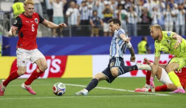 Record-breaking Messi sends Argentina into last 32
