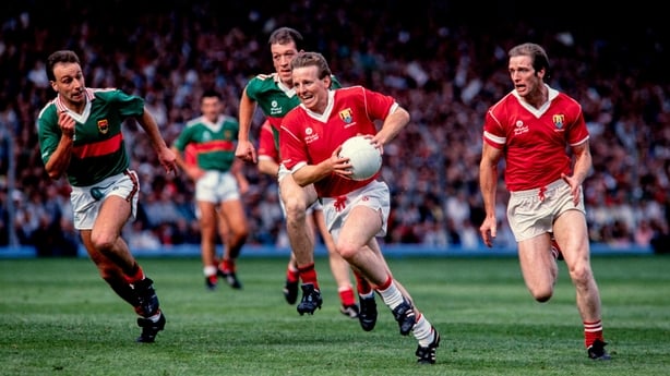 Current Cork manager John Cleary gets away from Mayo's TJ Kilgallon during the 1989 All-Ireland football final