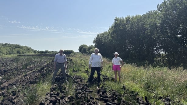 Pakie and John Dillon, with Pakie's daughter Laura on the bog.