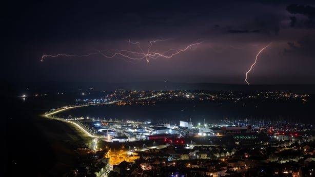 Lightning strikes are seen during a storm over Weymouth in the UK