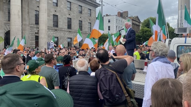 Malachy Steenson speaks at an anti-immigration march