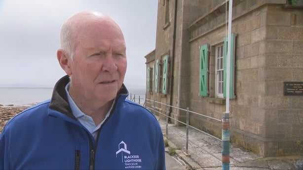 Picture of John Gallagher outside Blacksod Lighthouse and he is wearing a blue jacket