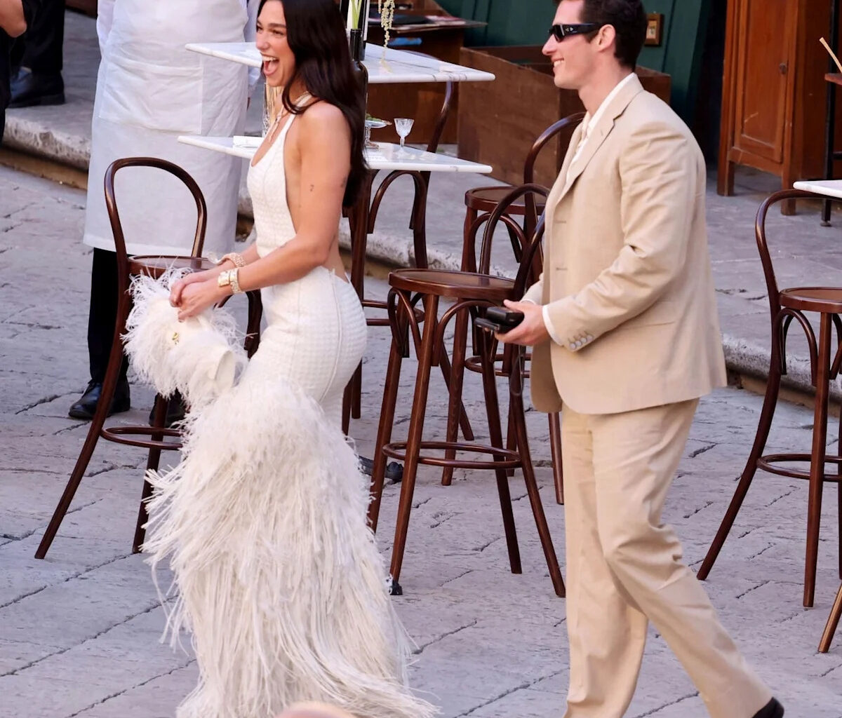 Dua Lipa Kicks Off Her Italian Wedding Weekend in a Feathery Backless Dress