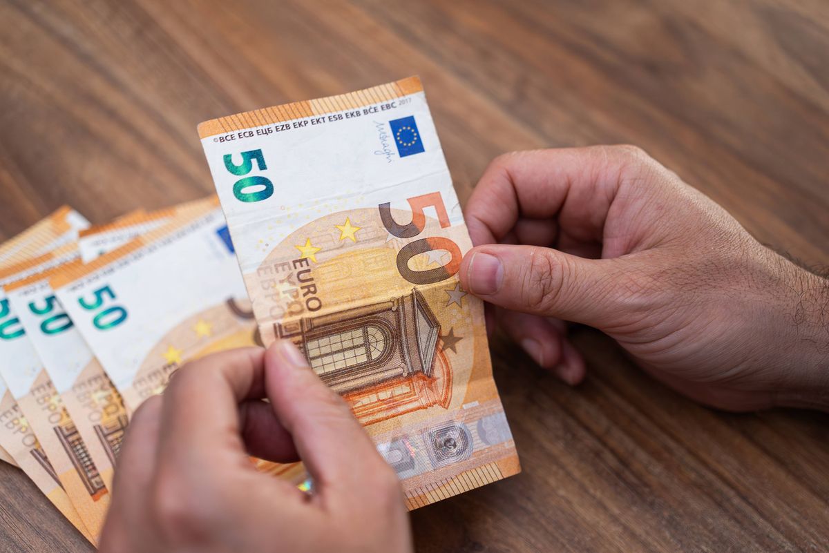 Euro notes in someone's hands