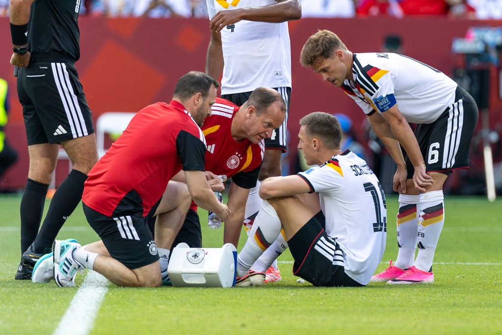 TORONTO, CANADA - JUNE 20: Nico Schlotterbeck #15 of Germany gets medical attention during the FIFA World Cup 2026 Group E match between Germany and Cote D'Ivoire at Toronto Stadium on June 20, 2026 in Toronto, Canada. (Photo by Michael Miller/ISI Photos/ISI Photos via Getty Images)