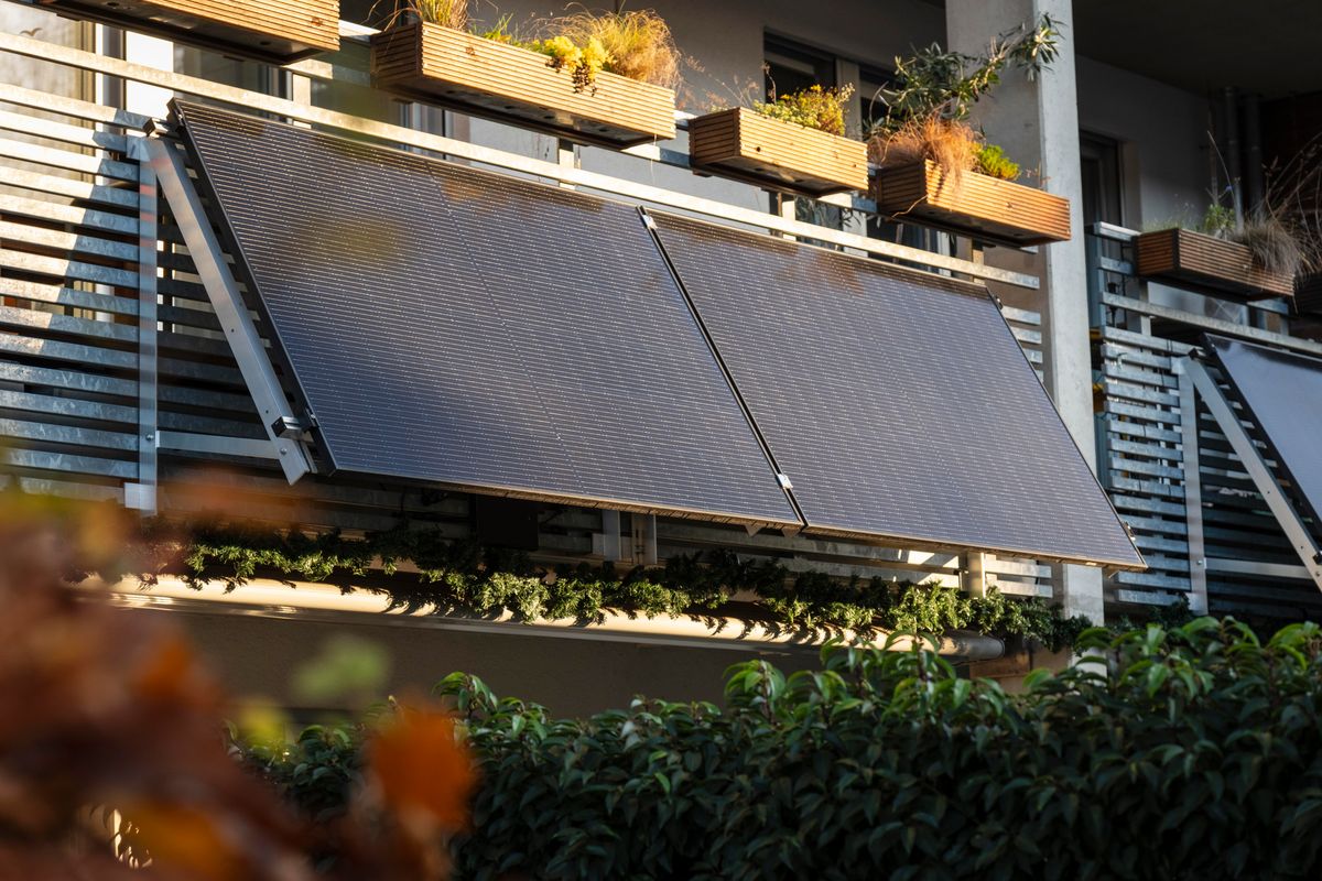 Plug-in solar panels in the sun over a balcony