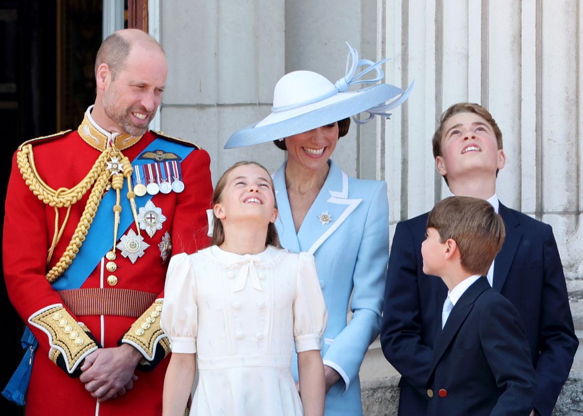 William stands proud with his wife and three children 