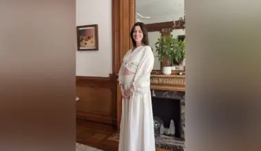 Anne Hathaway shared a video on her Instagram account of her stepping into frame and cradling her baby bump in a white flowy outfit as she smiled.