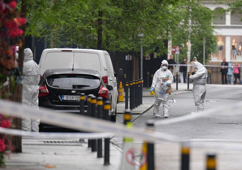 Forensic officers on Clarendon Street, Dublin, in the aftermath of the stabbing of Qayyum Balogun. Photograph: Niall Carson/PA Wire