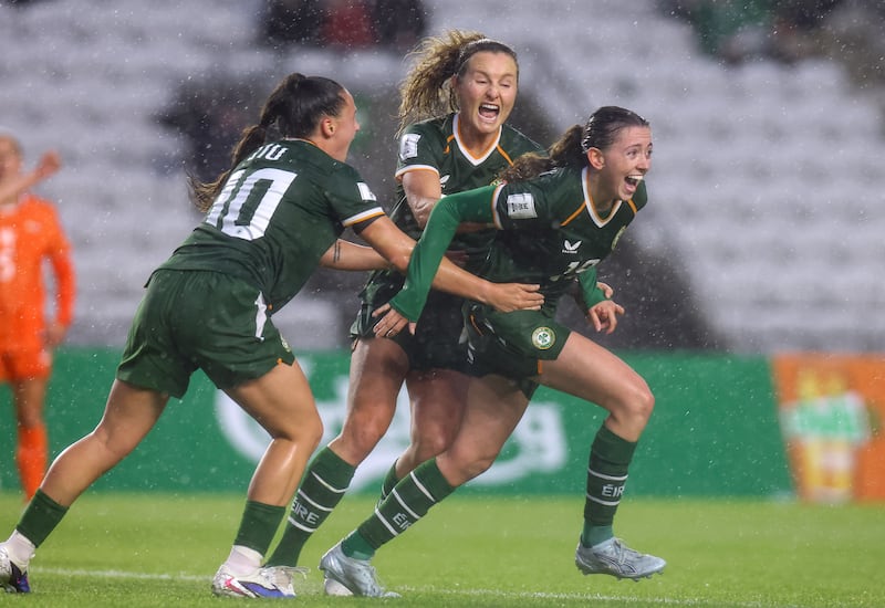 Ireland's Abbie Larkin celebrates with Jessica Ziu and Kyra Carusa after she scores her side's seconnd goal of the match. Photograph: Ben Brady/Inpho