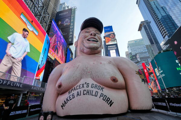A large inflatable figure depicting Elon Musk stands in Times Square in New York on Thursday, June 11, 2026. (AP Photo/Seth Wenig)