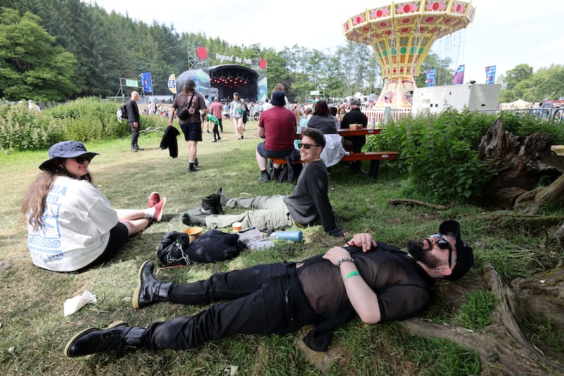 People relax near the main stage on the last day of the 2026 Beyond the Pale festival in Co Wicklow. Photograph: Alan Betson

