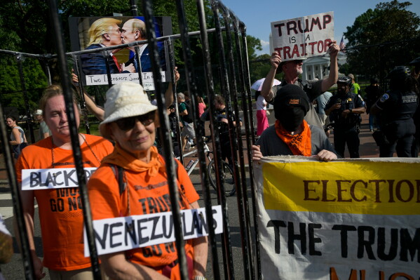 Protesters hold a short rally at Lafayette Square prior to the UFC Freedom 250 fights that are set to take place on the South Lawn of the White House in Washington, Sunday, June 14, 2026. (AP Photo/Rod Lamkey, Jr.)