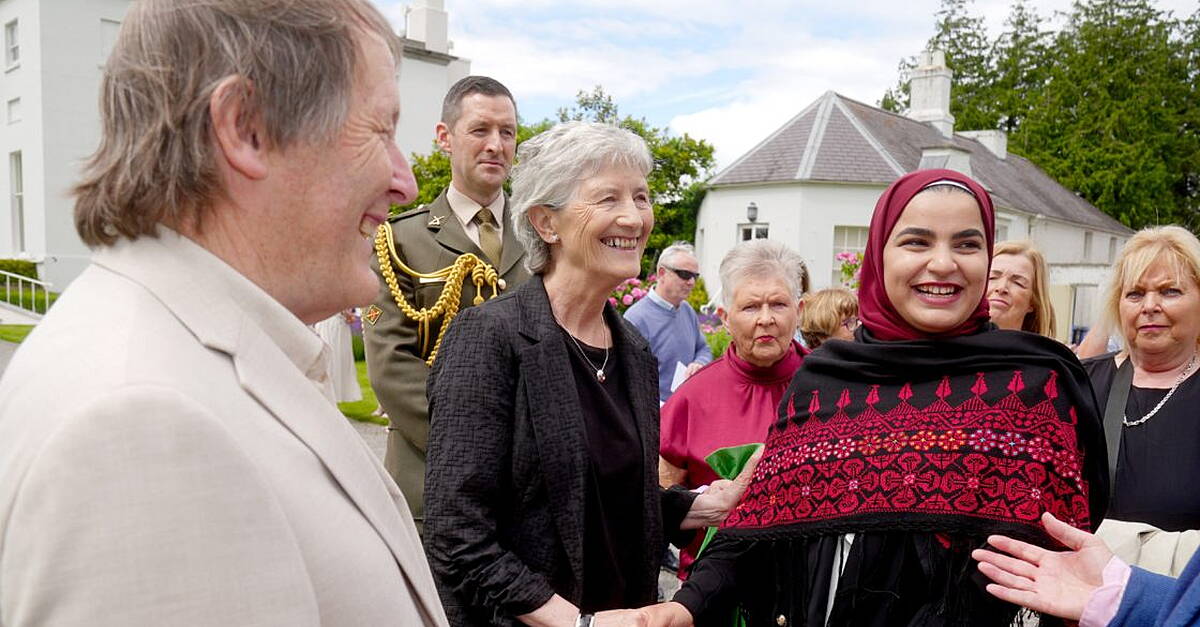 Cowboy hats and summer dresses at President’s first garden party