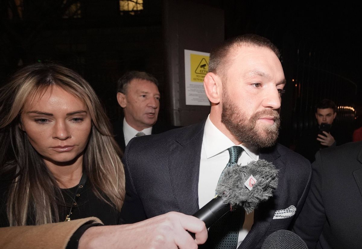 Conor McGregor and partner Dee Devlin leaving the High Court