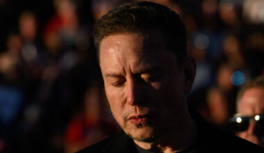 Elon Musk, chief executive officer of Tesla Inc., closes his eyes for a moment of silence, during a campaign rally for former president Donald Trump. Photographer: Justin Merriman/Bloomberg via Getty Images