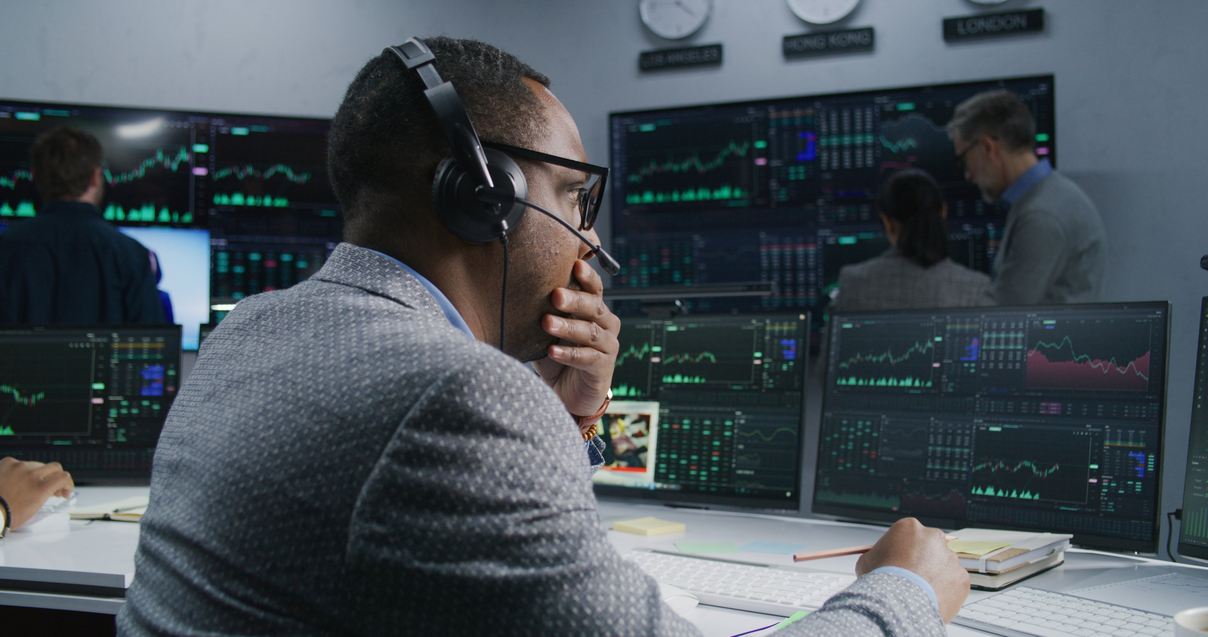 Person looking at multiple monitors.