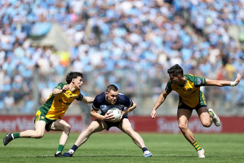 Dublin's Con O'Callaghan and Brendan McCole of Donegal struggle for possession at Croke Park. Photograph: Laszlo Geczo/Inpho