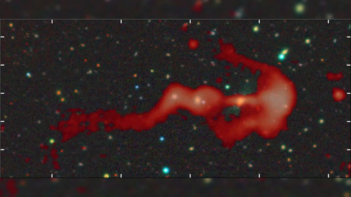 Strange glowing 'bow-and-arrow' structure may be a giant cosmic shock wave created by a supersonic galaxy c...