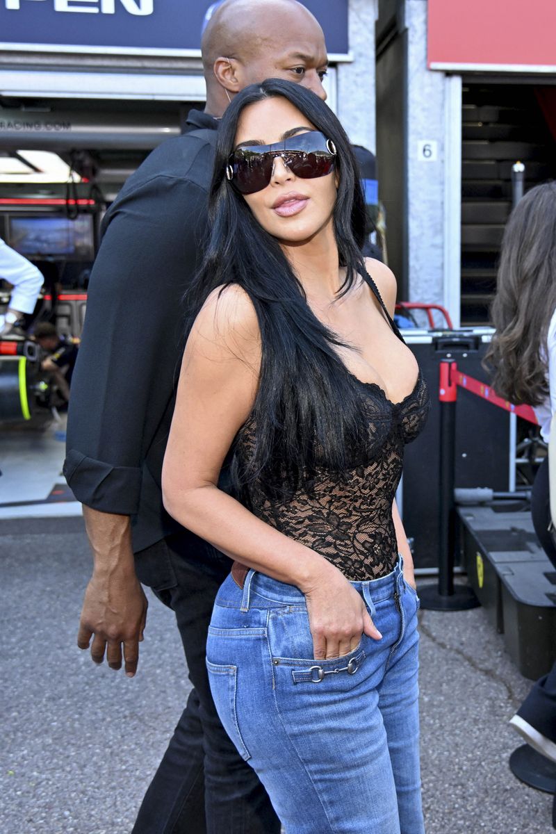 Kim Kardashian sparked debate among Formula 1 fans after stepping out in a sheer black lace top and oversized denim jeans during the Monaco Grand Prix weekend.