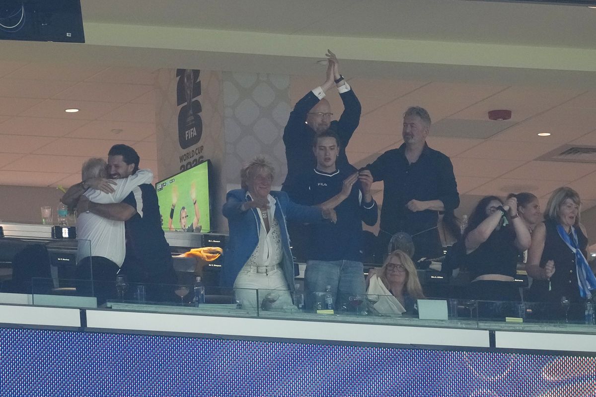 Rod Stewart (third left) celebrates in the stands after the FIFA World Cup Group C match at Boston Stadium, Foxborough.