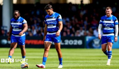 Beno Obano (left), Santiago Carreras (centre) and Ben Spencer (right) walk on the pitch looking dejected after the full-time whistle against Exeter