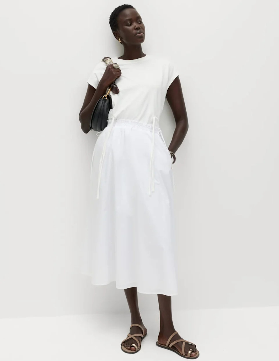 Too hot for denim? A white midi skirt is a summer staple