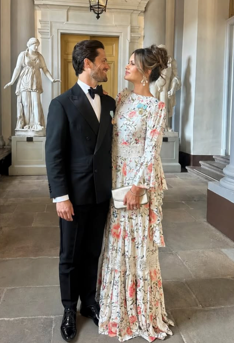 Prince Carl Philip and Princess Sofia share a sweet moment during the celebrations marking King Carl XVI Gustaf and Queen Silvia's Golden Wedding Anniversary at the Royal Swedish Opera in Stockholm.