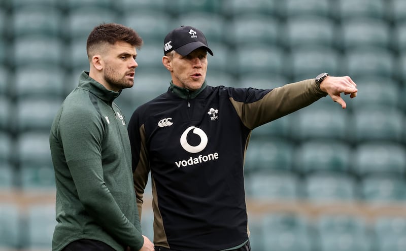 Ireland assistant coach Simon Easterby with Harry Byrne. Photograph: Billy Stickland/Inpho