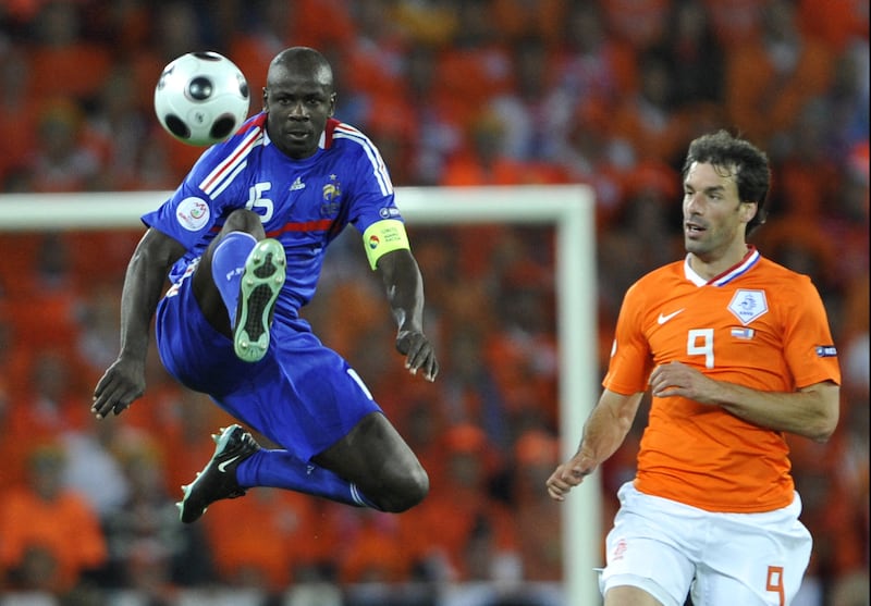 French defender Lilian Thuram jumps to control the ball next to Dutch forward Ruud van Nistelrooy during a Euro 2008 match. Photograph: Franck Fife/AFP via Getty Images 