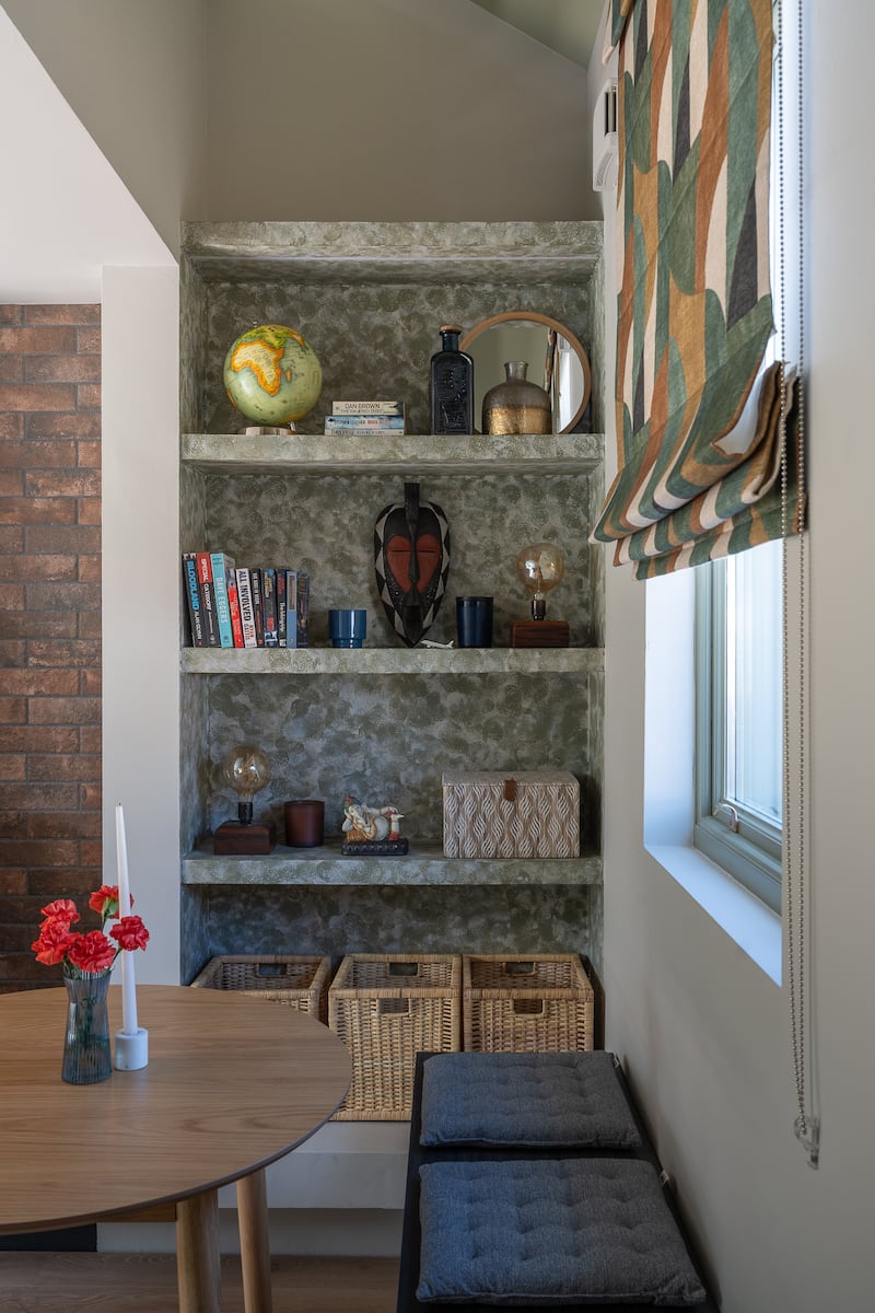 Dining area, with a bench and floating shelves for added storage