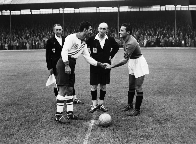 Italy captain Maino Neri (left) shakes hands with USA counterpart John Souza before a first-round match at Griffin Park, Brentford during the London Olympics in 1948. Photograph: Keystone/Hulton Archive/Getty Images