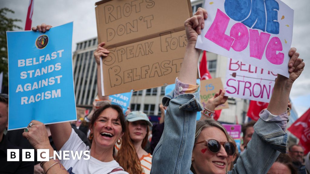 Thousands gather for anti-racism rally in Belfast after disorder - BBC