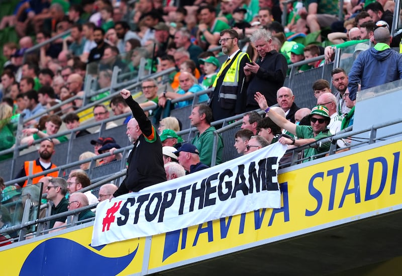 Fans protest with a boycott banner and Palestinian flags during an international friendly match at the Aviva Stadium, Dublin. Photograph: Brian Lawless/PA Wire