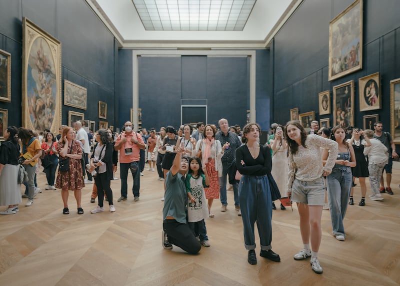 Visitors in the Salle des Etats, at the Louvre in Paris. Photograph: Andrea Mantovani/The New York Times