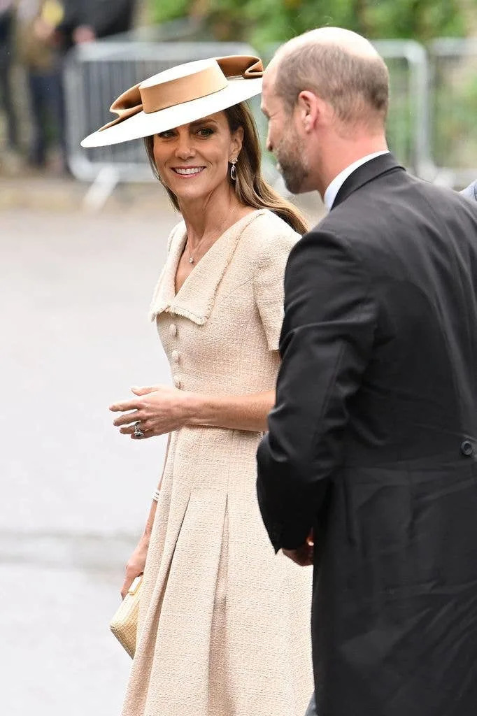 Catherine, Princess of Wales and Prince William, smiling and walking together