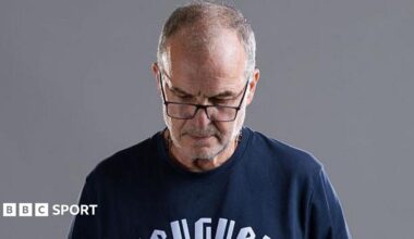 Marcelo Bielsa looks down at a World Cup promo photoshoot