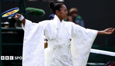 Naomi Osaka wears an all-white kimono as she prepares to warm-up before her first-round match at Wimbledon