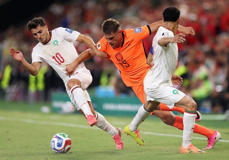 Micky van de Ven of the Netherlands competes for the ball against Brahim Diaz (10) and Achraf Hakimi of Morocco. Photograph: Carl Recine/Getty Images