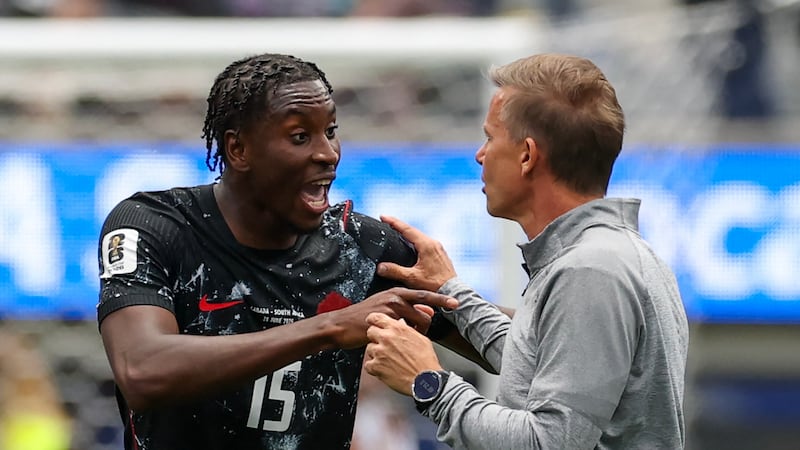 Canada head coach Jesse Marsch speaks with Moise Bombito after the half-time whistle.  Photograph: Etienne Laurent/AFP via Getty Images