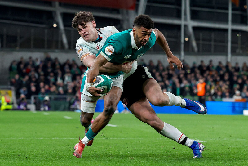 Ireland's Robert Baloucoune is tackled by Wales' Eddie James during this year's Guinness Six Nations Championship game at Aviva Stadium. Picture: Inpho/Ben Brady