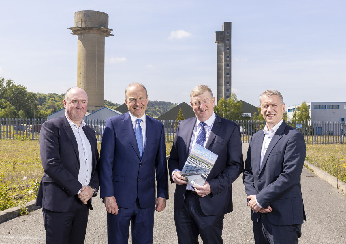 (Left to right) Niall Molloy, CEO of Echelon Data Centres, Taoiseach Micheál Martin, Senator Pat Casey and Graeme McWilliams, COO at the official launch of the Echelon Data Centres campuses last year. A recent Friends of the Earth report shows household energy bills skyrocket largely due to data centre demand. Photo: Peter Houlihan