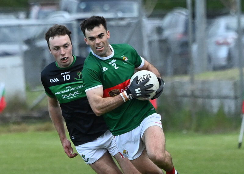 Clonakilty's David Lowney gets away from Nemo Rangers' Oisin Whyte. Picture: Martin Walsh.