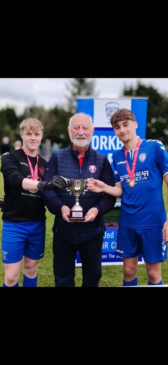 Corkbeg co-captains Jamie Walsh and Jago Evan’s  been presented with the Daly Industrial Supplies U18 League 3 Cup by the Cork Youth League Mr Sean O’Sullivan recently. KD 